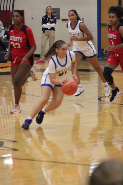 Aleigh Richards (11) Crossing up girls on the court.