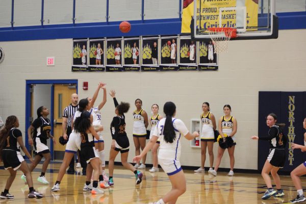 Sashs Reid (12) goes up for the lay-up.